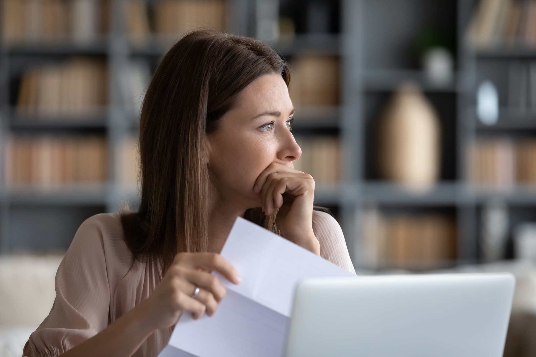 Woman figuring out how to handle high asset division during her divorce.